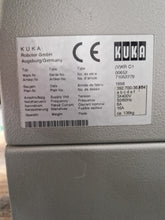 Load image into Gallery viewer, Used-for-sale : The KUKA KCP1 teach pendant, used with the KR15/2 industrial robot, is a robust and intuitive interface for programming, operating, and diagnosing KUKA systems. With its integrated display, navigation keys, mode selector (T1, T2, AUT), emergency stop, and safety deadman switch, it ensures precise and secure control during teaching and maintenance tasks.
